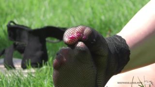 Striptease Mistress Legs In Sexy In Fishnets Socks On The Grass Speculum