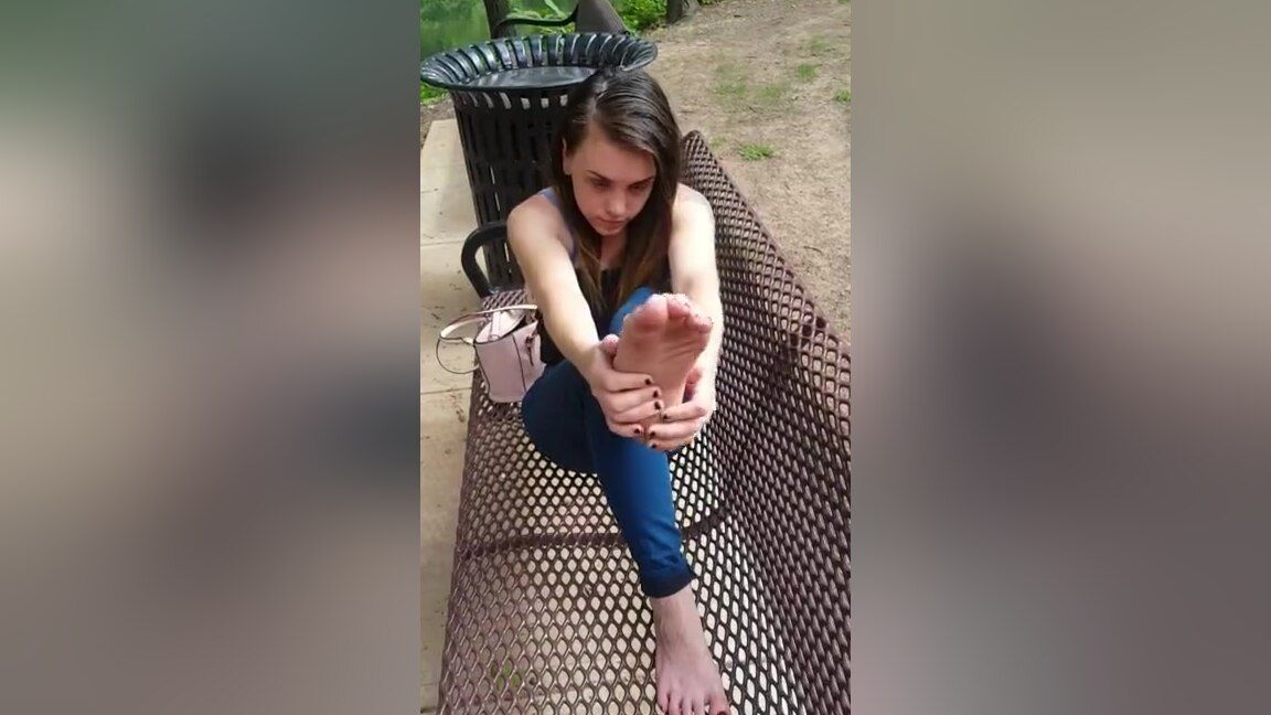Olderwoman Beautiful Teen In Jeans Sitting On The Bench Outdoors Playing With Her Feet SoloPorn - 1