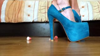 Latino Naughty Woman Enjoys Crushing Some Candies With Her Super Sexy High Heels Leche