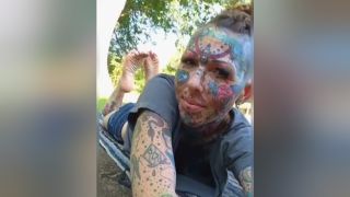 Little Female Freak With A Tattooed Face & Body Exposing Sexy Soles In The Background Gayclips
