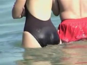 Web Cam Girl in wet swimsuit staying back to the candid...